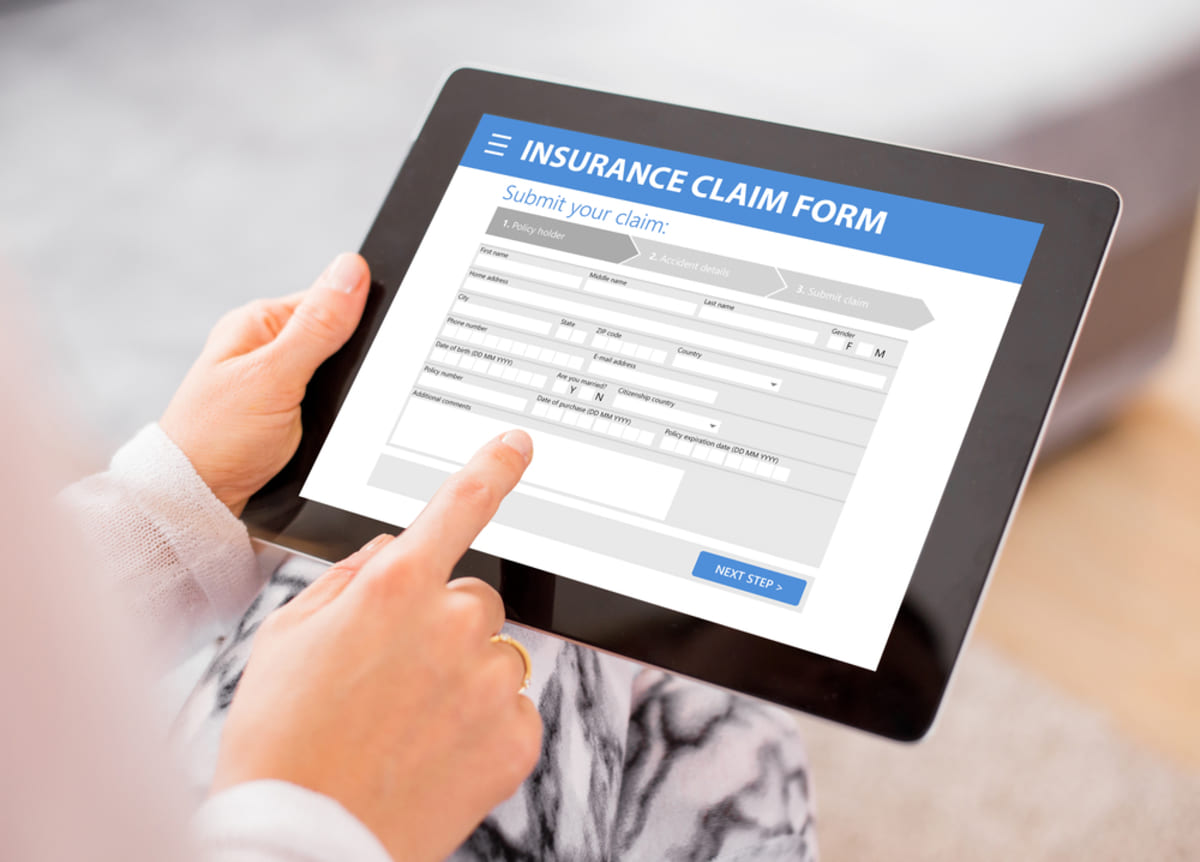 A tablet that shows an insurance claim form