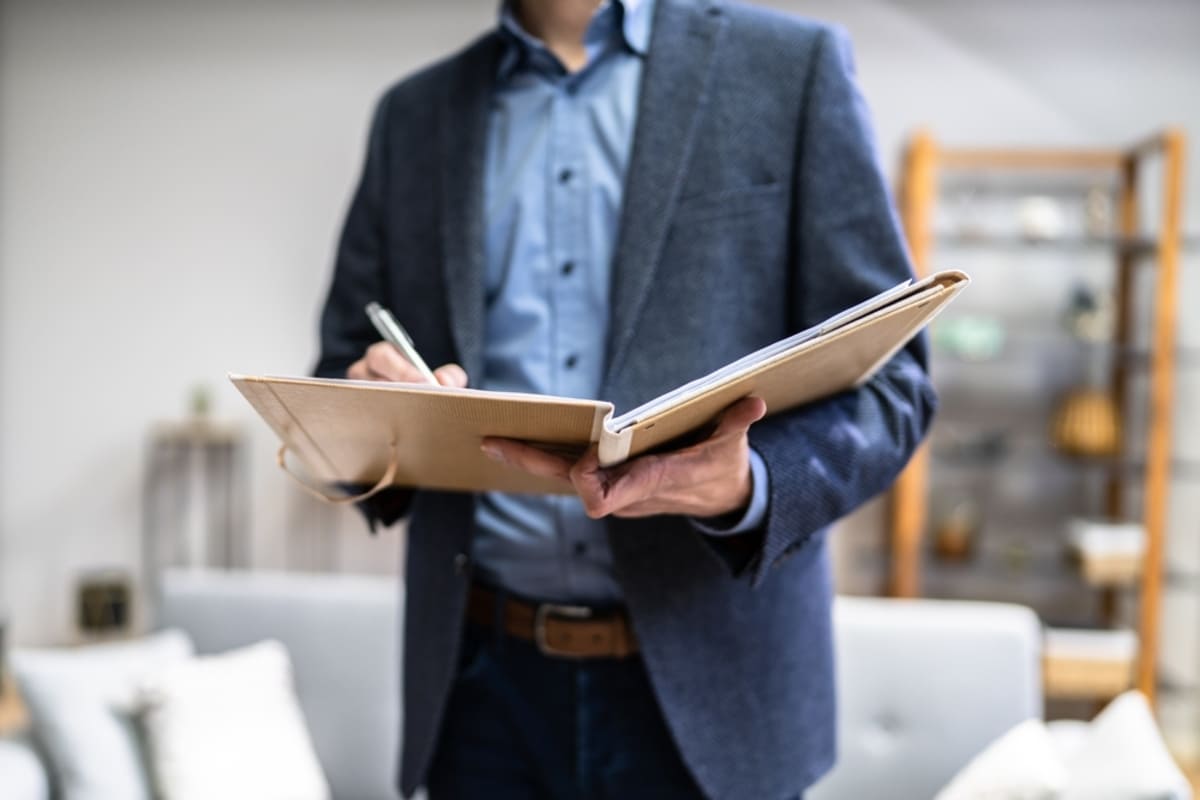 A man in a rental property conducting an inspection